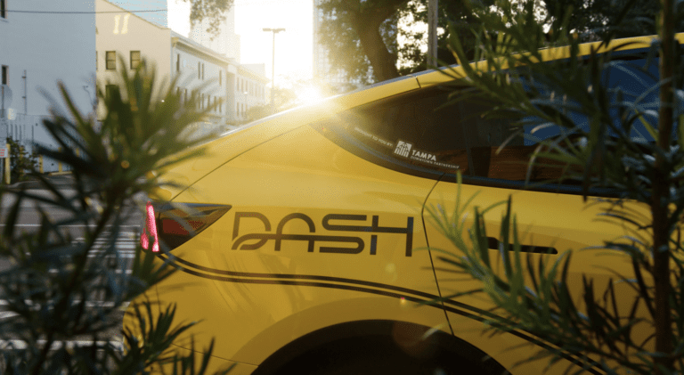 Water Street wayfinding sign that reads Tampa Bay History Center. Learn more about the Flexible Guest Pass at Visitor Services.